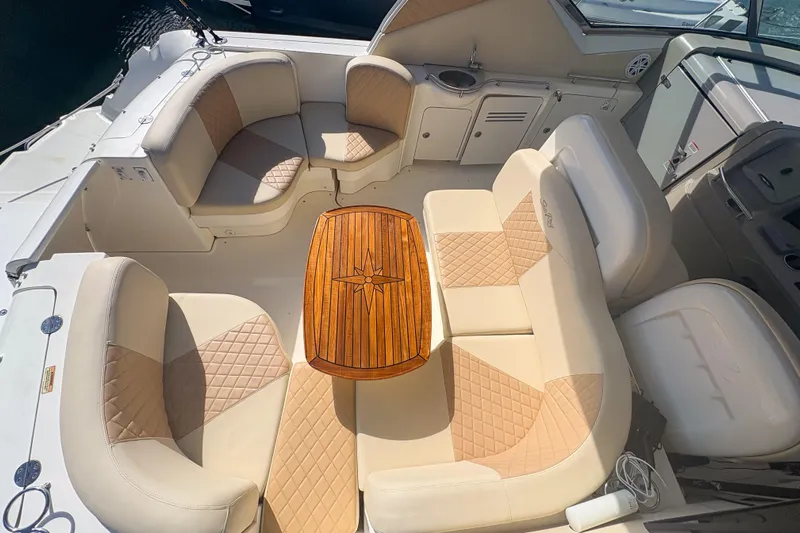 Luna Yacht Photos Pics Luxurious seating area on a 2008 Sea Ray 380 Sundancer yacht with elegant wood table.