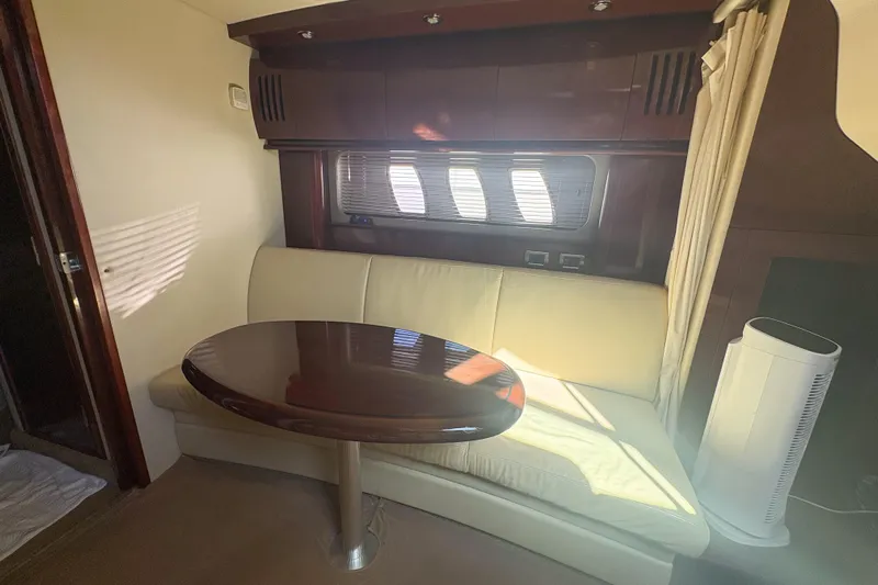 Luna Yacht Photos Pics Interior of 2008 Sea Ray 380 Sundancer with elegant seating and wooden table.