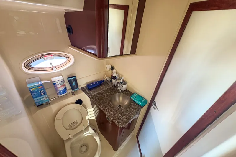 Luna Yacht Photos Pics Bathroom interior of 2008 Sea Ray 380 Sundancer yacht, featuring sink and toilet.