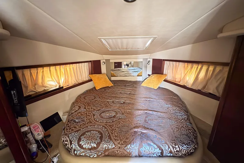 Luna Yacht Photos Pics Luxurious cabin interior of 2008 Sea Ray 380 Sundancer with elegant bedding and soft lighting.