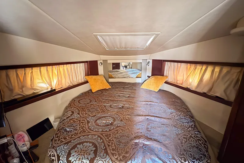 Luna Yacht Photos Pics Luxurious cabin interior of 2008 Sea Ray 380 Sundancer with elegant bedding and soft lighting.