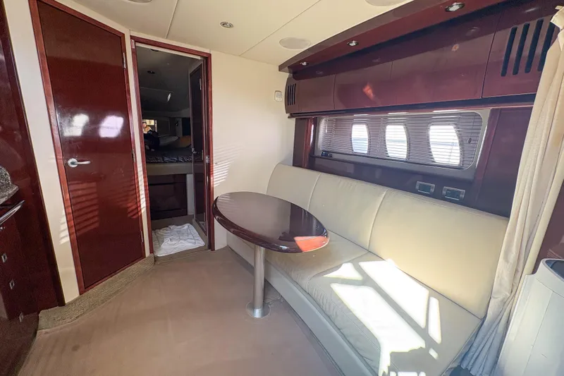 Luna Yacht Photos Pics Luxurious interior of 2008 Sea Ray 380 Sundancer yacht with elegant seating and table.