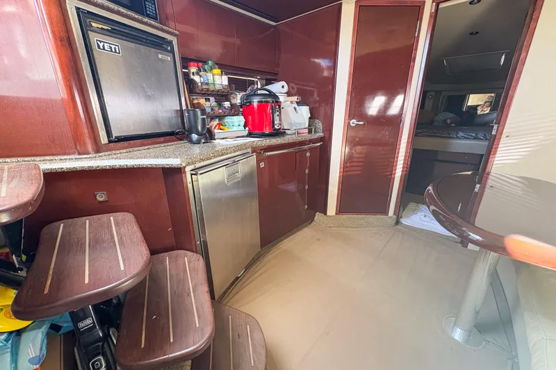 Luna Yacht Photos Pics Interior of 2008 Sea Ray 380 Sundancer yacht with kitchen and seating area.