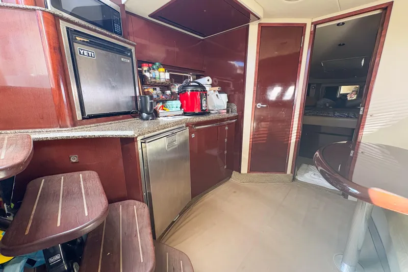 Luna Yacht Photos Pics Interior of 2008 Sea Ray 380 Sundancer yacht with kitchen and dining area.