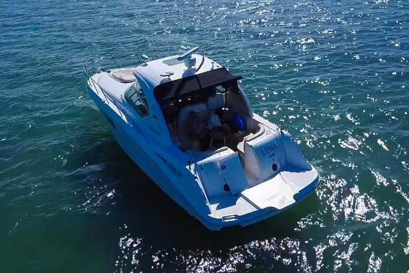 Luna Yacht Photos Pics 2008 Sea Ray 380 Sundancer yacht cruising on sparkling blue water.