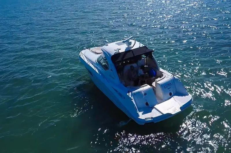 Luna Yacht Photos Pics 2008 Sea Ray 380 Sundancer cruising on sparkling blue water.