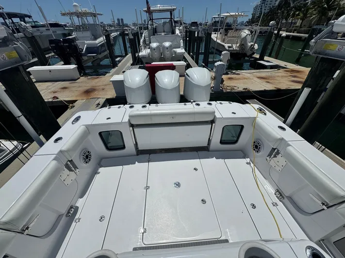  Yacht Photos Pics 2020 Sportsman Open 352 Center Console boat docked at marina, featuring spacious deck layout.