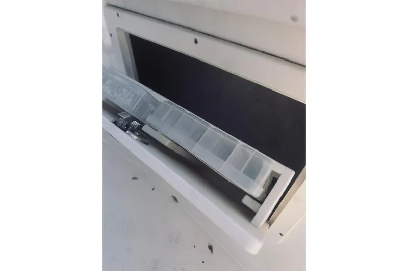 Robalo 272 Yacht Photos Pics 2022 Robalo R272 Center Console storage compartment with tackle box.