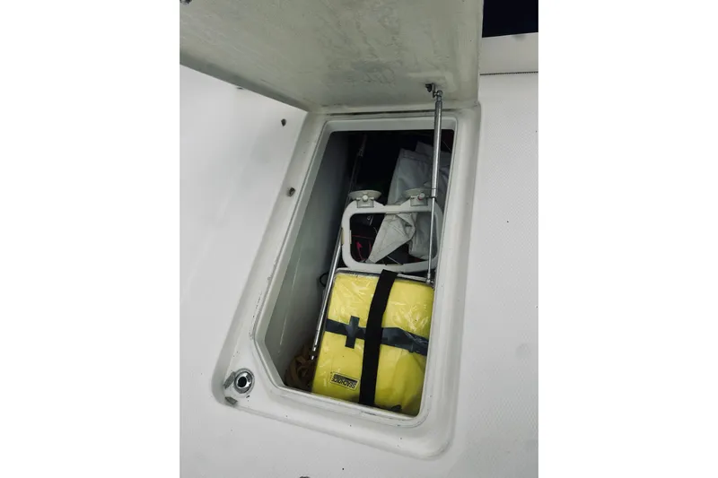 Robalo 272 Yacht Photos Pics Storage compartment on 2022 Robalo R272 Center Console boat with safety equipment.