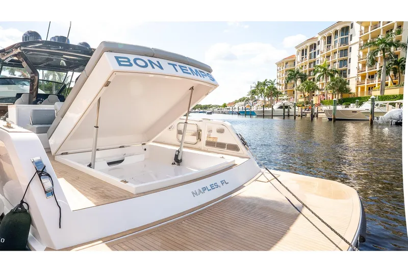  Yacht Photos Pics 2024 Pardo Yachts 43 docked in Naples, FL, with open storage compartment.