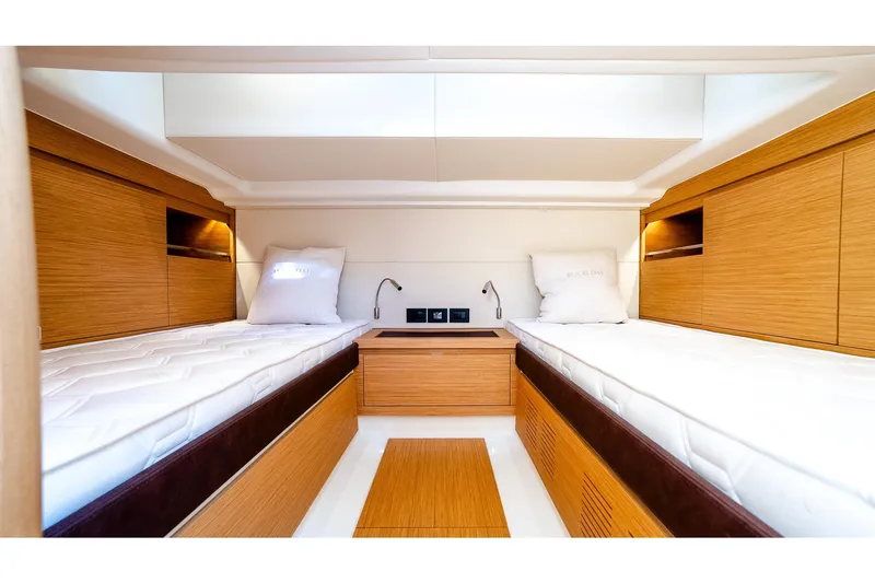  Yacht Photos Pics Luxurious cabin interior of 2024 Pardo Yachts 43 with twin beds and wooden finish.