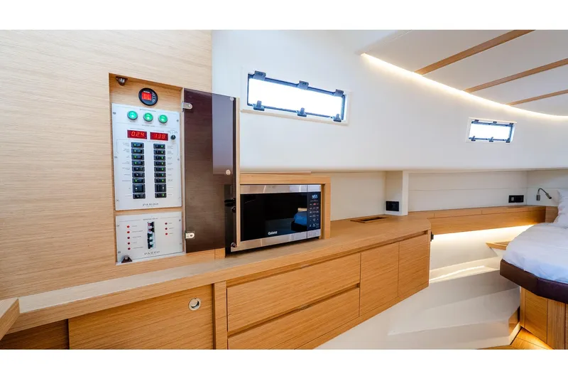 Yacht Photos Pics Luxurious interior of 2024 Pardo Yachts 43, featuring modern cabinetry and control panel.