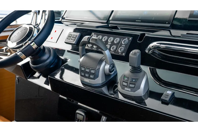  Yacht Photos Pics Helm controls of 2024 Pardo Yachts 43, featuring steering wheel and joystick.