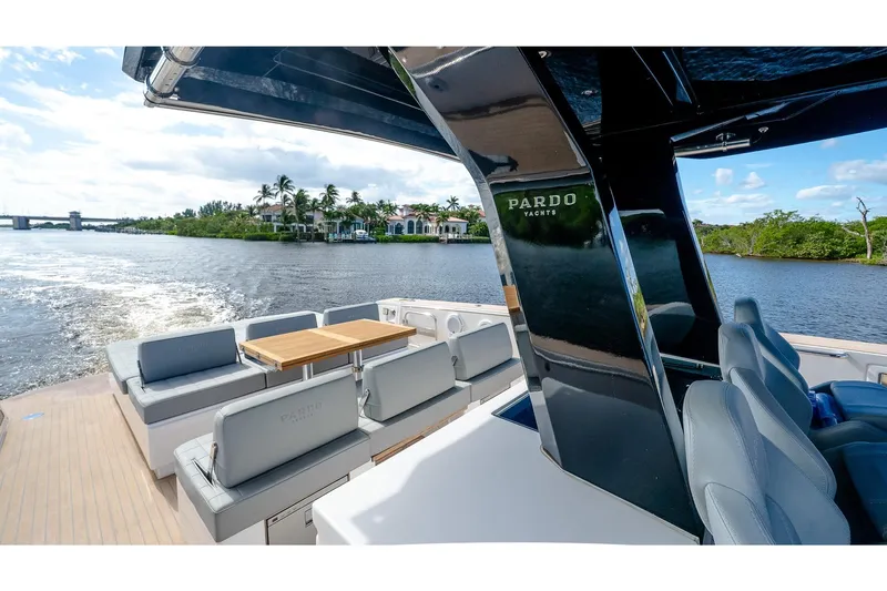  Yacht Photos Pics 2024 Pardo Yachts 43 cruising on a scenic river with luxurious seating and sleek design.