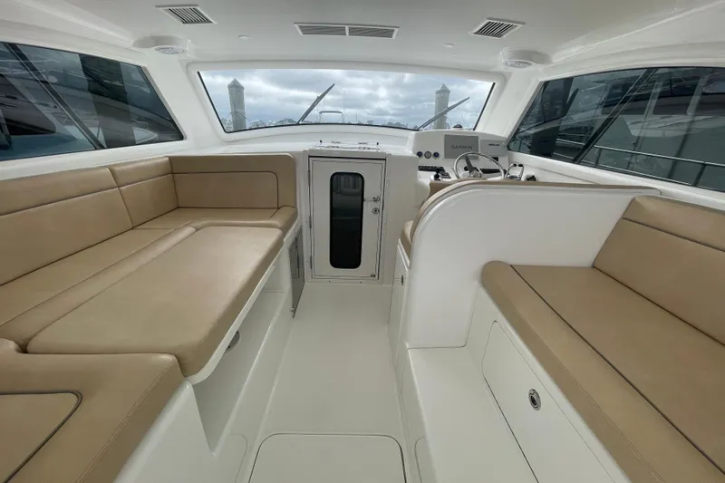 Lady Faye Yacht Photos Pics Interior of 2018 Viking 37 Billfish yacht with beige seating and helm station.