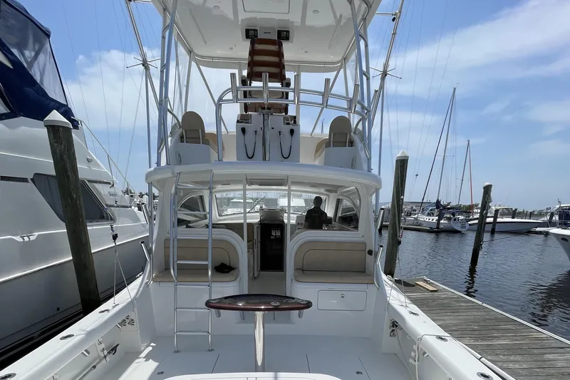 Lady Faye Yacht Photos Pics 2018 Viking 37 Billfish yacht docked at marina, showcasing spacious deck and tower.
