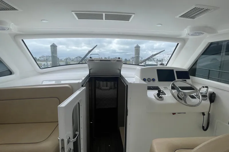 Lady Faye Yacht Photos Pics Interior view of 2018 Viking 37 Billfish yacht cockpit with helm and seating.