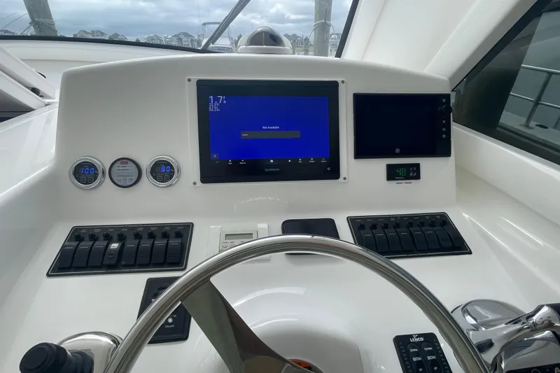Lady Faye Yacht Photos Pics Control panel of 2018 Viking 37 Billfish boat with navigation and monitoring systems.