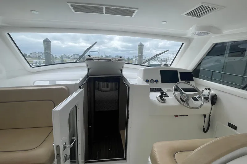 Lady Faye Yacht Photos Pics 2018 Viking 37 Billfish interior with helm, controls, and cabin entrance.