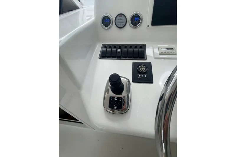 Lady Faye Yacht Photos Pics Control panel of 2018 Viking 37 Billfish boat with joystick and gauges.
