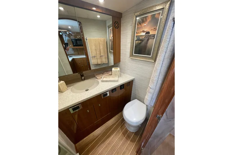 Lady Faye Yacht Photos Pics Luxurious bathroom in 2018 Viking 37 Billfish yacht with modern fixtures and elegant decor.