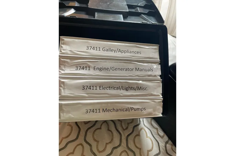 Lady Faye Yacht Photos Pics Binders labeled for Viking 37 Billfish 2018: Galley, Engine, Electrical, Mechanical manuals.