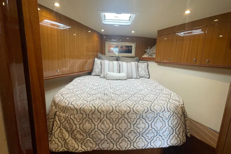 Lady Faye Yacht Photos Pics Luxurious cabin interior of 2018 Viking 37 Billfish yacht with elegant bedding.