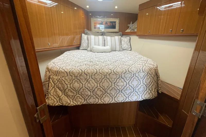 Lady Faye Yacht Photos Pics Luxurious cabin interior of 2018 Viking 37 Billfish with elegant bedding and wood finish.