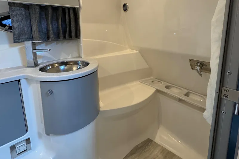  Yacht Photos Pics 2020 Formula 370 SS bathroom interior with modern sink and shower.