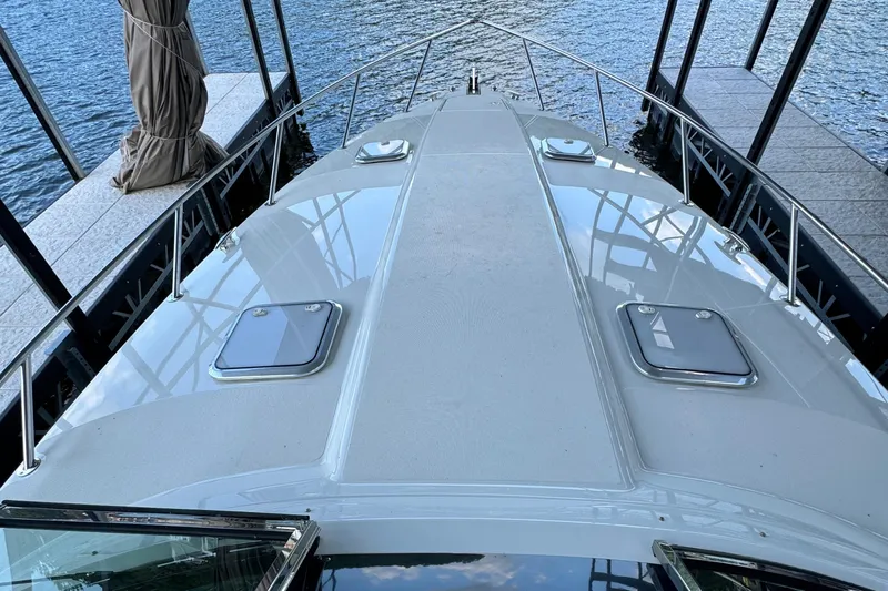  Yacht Photos Pics 2020 Formula 370 SS boat docked, showcasing sleek deck design and water reflections.