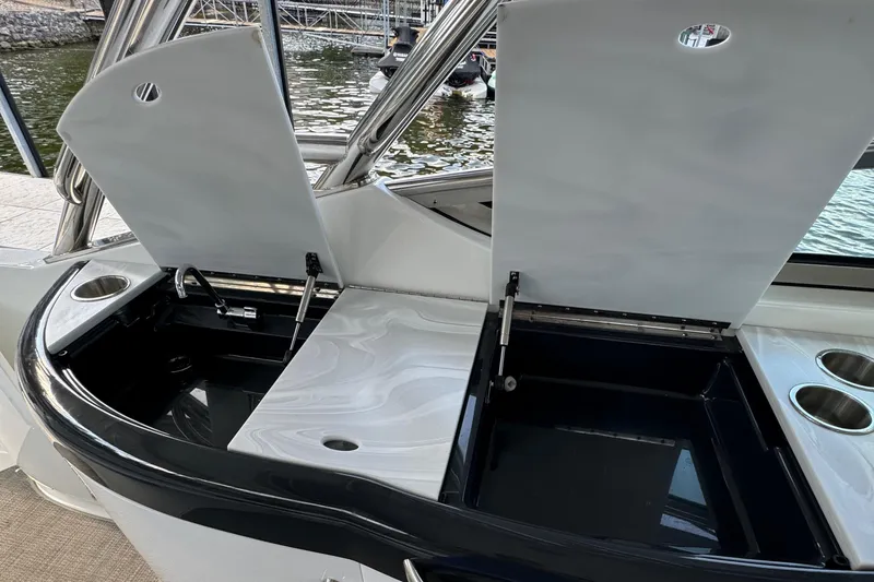  Yacht Photos Pics 2020 Formula 370 SS boat with open storage compartments and cup holders.