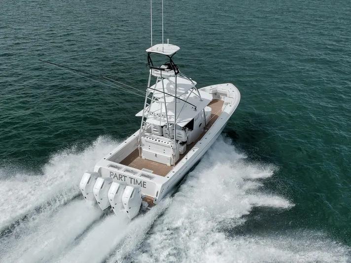  Yacht Photos Pics 2024 Contender 44 ST boat cruising on open water, rear view.