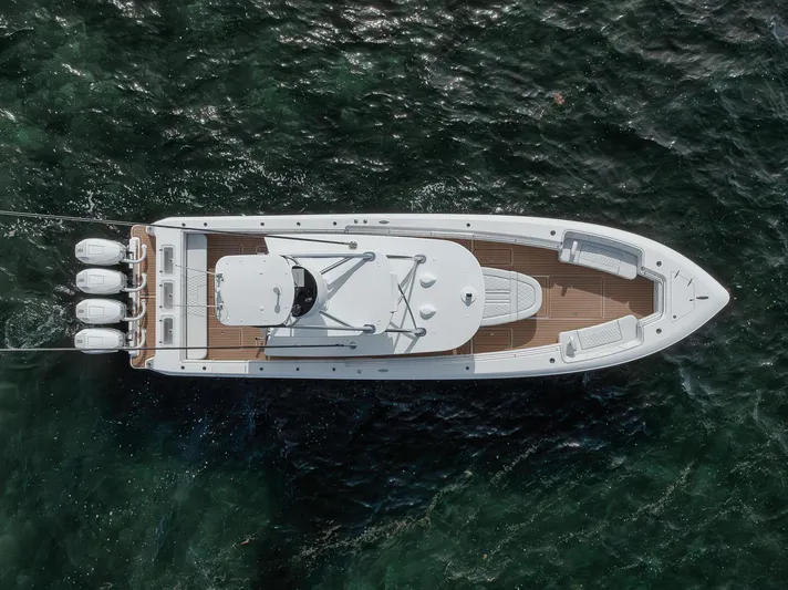  Yacht Photos Pics Aerial view of 2024 Contender 44 ST boat on water, showcasing sleek design and powerful engines.