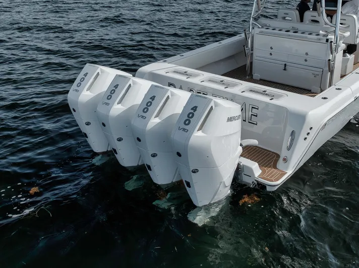  Yacht Photos Pics 2024 Contender 44 ST boat with four powerful outboard engines on the water.