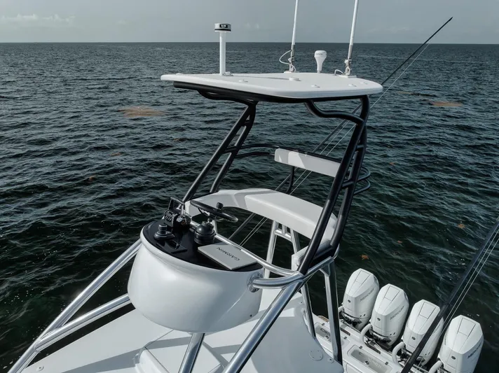  Yacht Photos Pics 2024 Contender 44 ST boat with tower and multiple engines on open water.