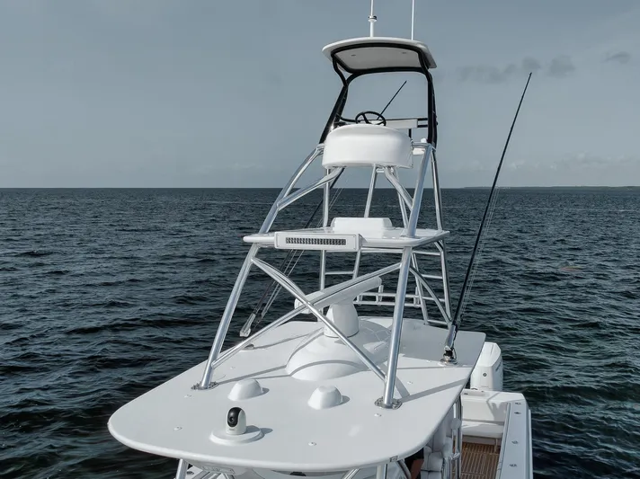  Yacht Photos Pics 2024 Contender 44 ST boat on open water, showcasing tower and sleek design.