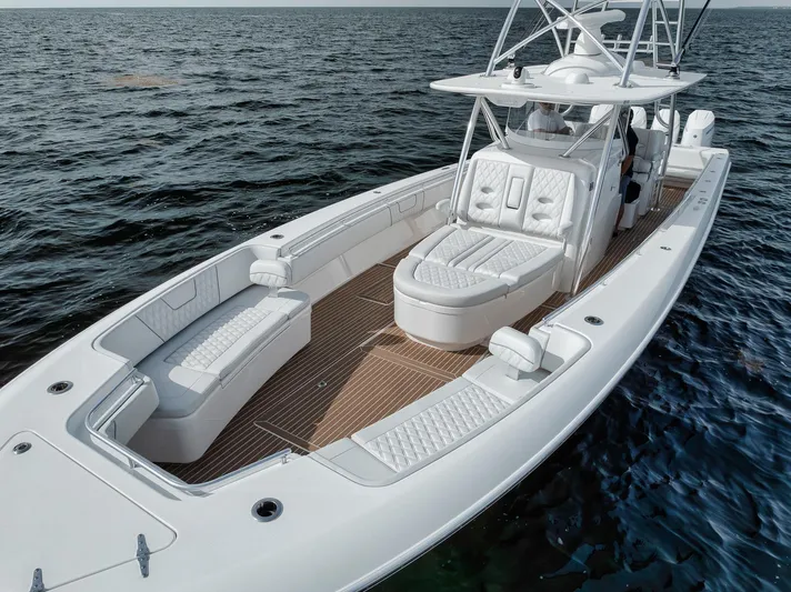  Yacht Photos Pics 2024 Contender 44 ST boat on water, featuring sleek design and spacious deck layout.