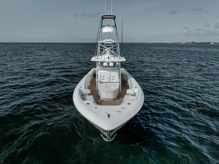  Yacht Photos Pics 2024 Contender 44 ST boat on open sea, aerial view.