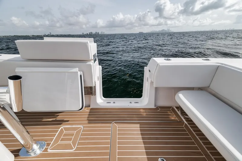  Yacht Photos Pics 2024 Contender 44 ST boat deck with ocean view and seating.