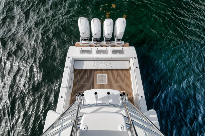  Yacht Photos Pics 2024 Contender 44 ST boat with four engines, viewed from above on water.