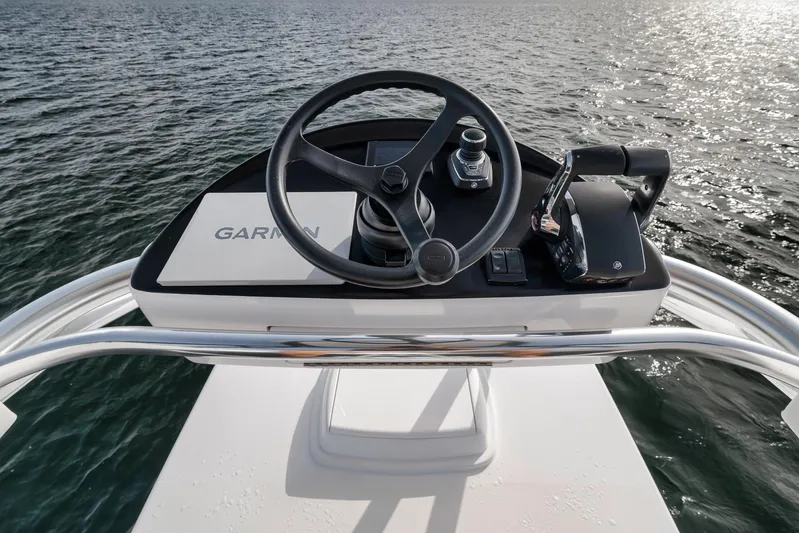  Yacht Photos Pics 2024 Contender 44 ST helm with Garmin navigation on open water.