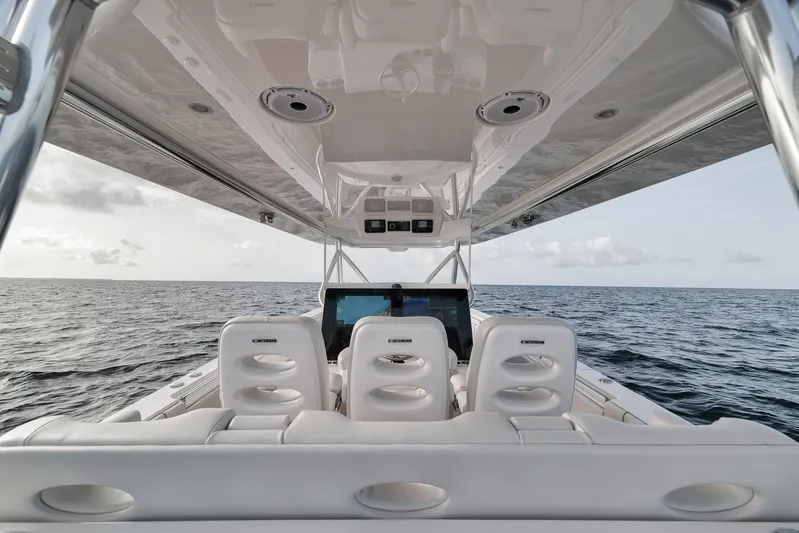  Yacht Photos Pics 2024 Contender 44 ST boat interior with ocean view, featuring sleek white seating and modern design.