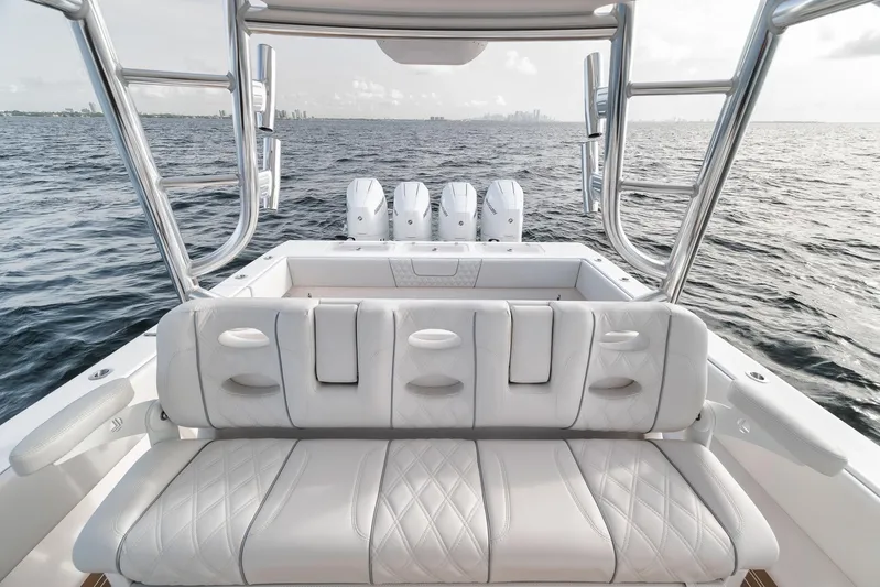  Yacht Photos Pics 2024 Contender 44 ST boat with luxurious seating and powerful engines on open water.