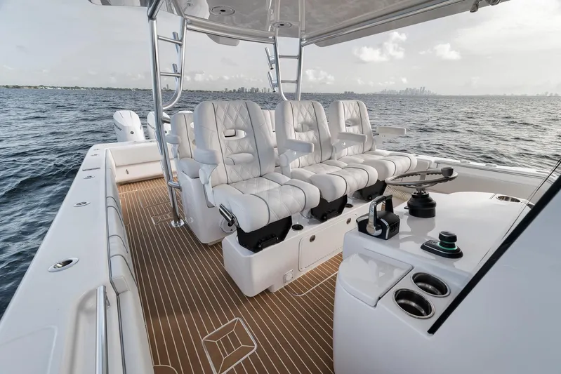  Yacht Photos Pics 2024 Contender 44 ST boat interior with luxurious seating and ocean view.