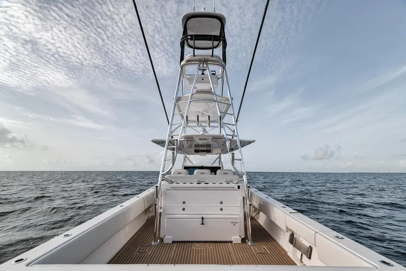  Yacht Photos Pics 2024 Contender 44 ST boat on open sea with clear sky.