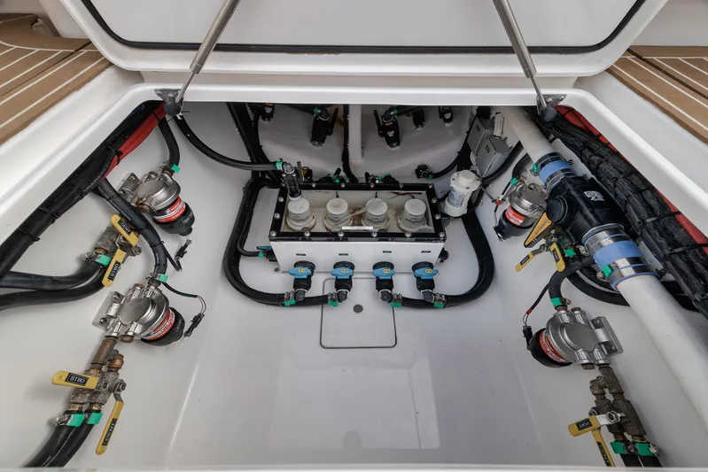  Yacht Photos Pics 2024 Contender 44 ST engine compartment with advanced plumbing and wiring systems.