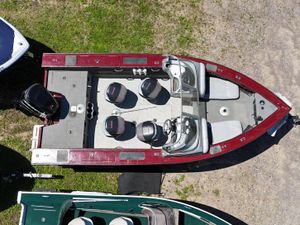 Aerial view of 2011 Tracker Targa V-18 Combo boat, parked on grass.