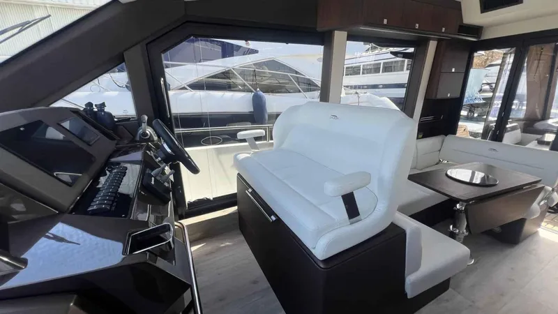  Yacht Photos Pics Interior of 2024 Galeon 410 HTC yacht with modern helm and seating area.