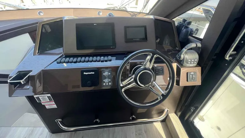  Yacht Photos Pics Helm of 2024 Galeon 410 HTC yacht with modern controls and steering wheel.