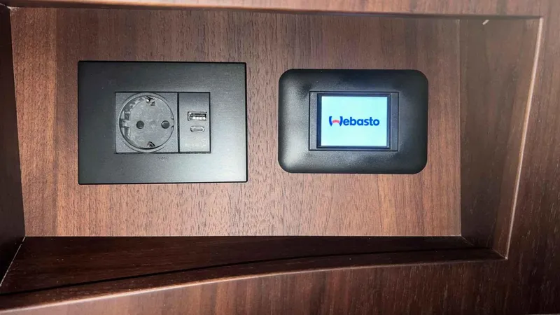  Yacht Photos Pics Power outlet and Webasto control panel on 2024 Galeon 410 HTC yacht interior.